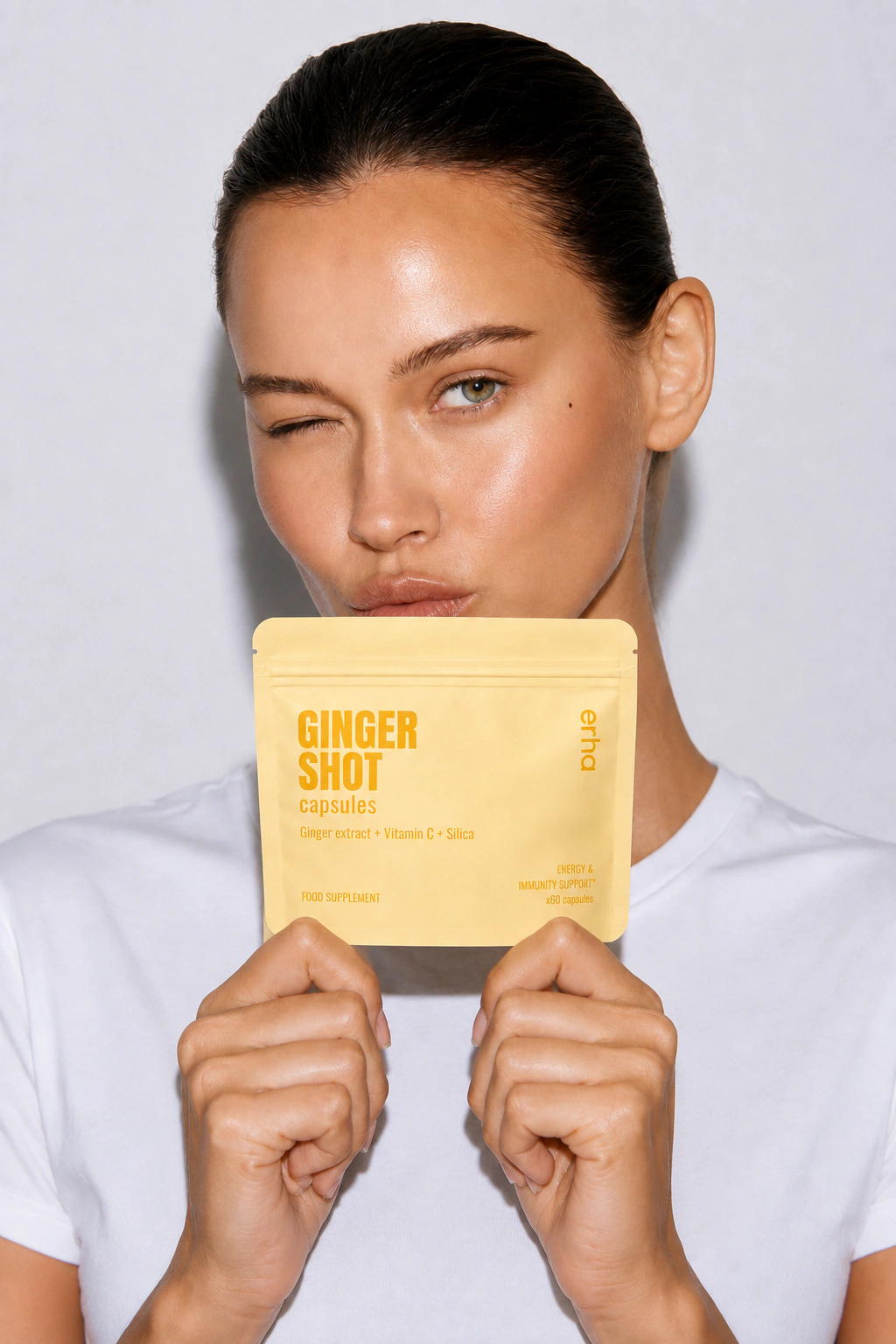 erha campaign portrait with an erha Ginger Shot capsules pouch